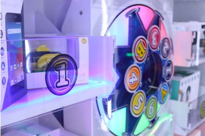 Magic Arrow - A Closeup of the colourfully lit target wheel and prize stand